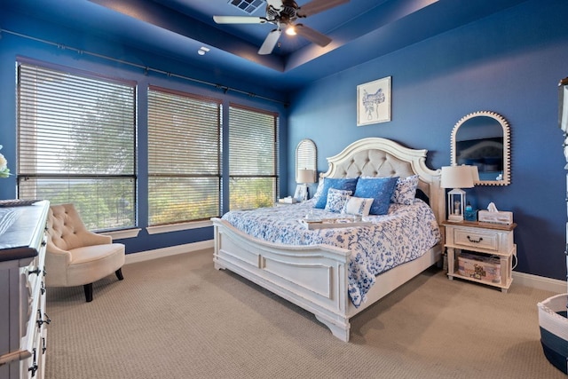 carpeted bedroom with a ceiling fan and baseboards