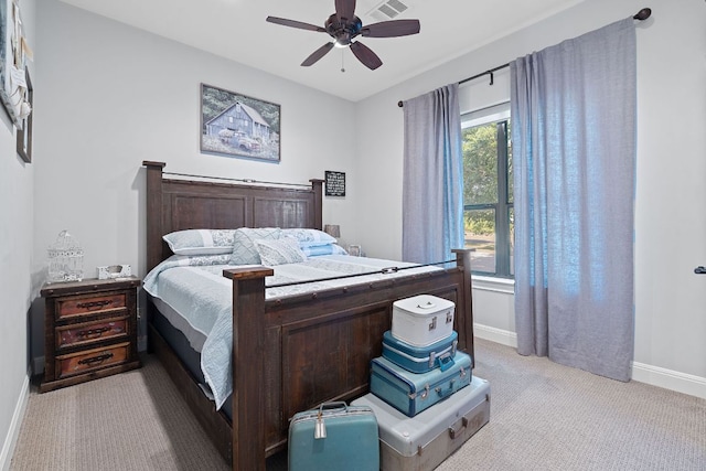 bedroom with baseboards, a ceiling fan, and light colored carpet
