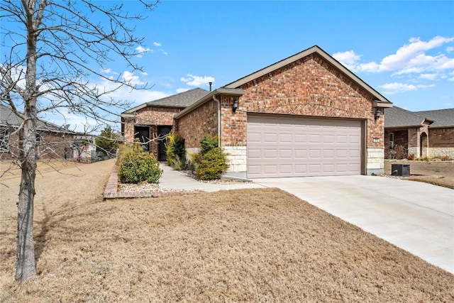 313 Brenham Pass, Georgetown, TX 78633 - single story home featuring fence, a shingled roof, driveway, brick siding, and a garage