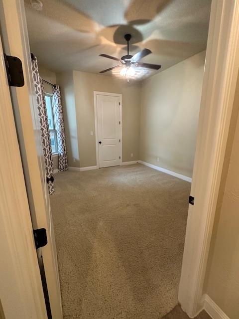 201 Grand Oaks Ln, Georgetown, TX 78628 - carpeted empty room with ceiling fan and baseboards