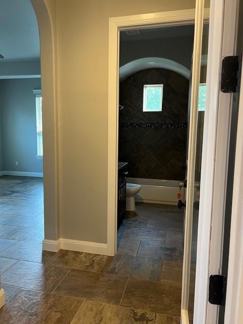 201 Grand Oaks Ln, Georgetown, TX 78628 - full bath with stone tile floors, toilet, and baseboards