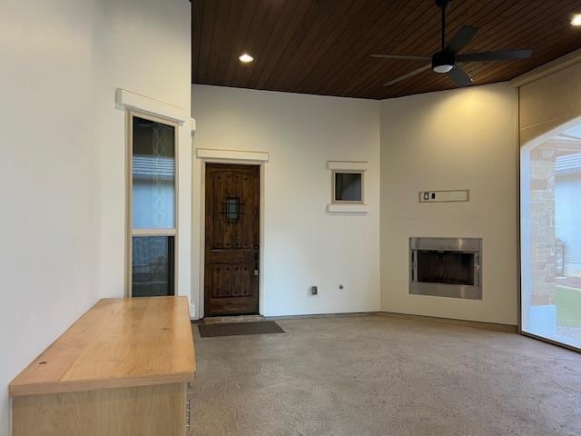 201 Grand Oaks Ln, Georgetown, TX 78628 - unfurnished living room featuring ceiling fan, wood ceiling, carpet, recessed lighting, and a fireplace