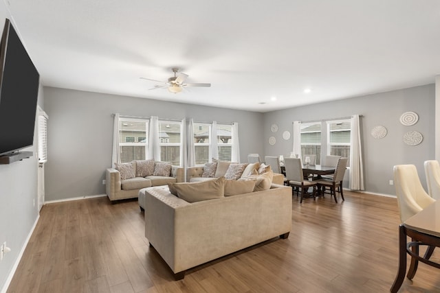 209 River Rise Rd, Kyle, TX 78640 - living area with a ceiling fan, wood finished floors, and recessed lighting