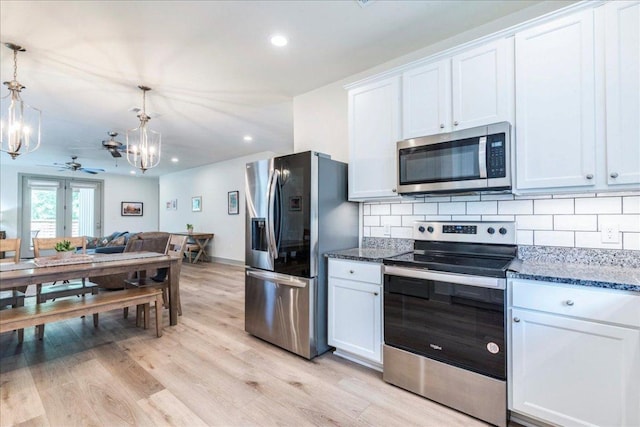 638 Oak Ln, Cottonwood Shores, TX 78657 - kitchen with stainless steel appliances, ceiling fan, backsplash, dark stone counters, and recessed lighting