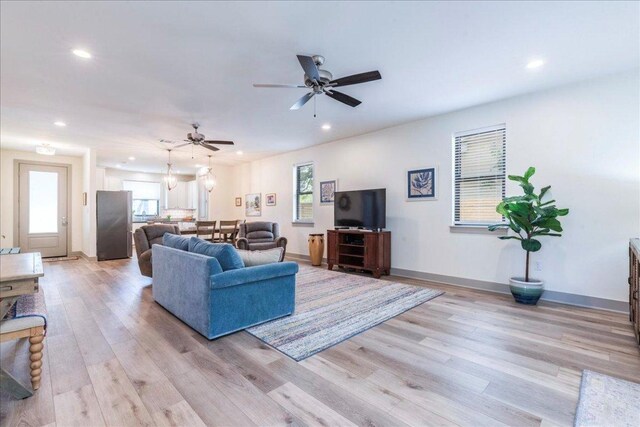 638 Oak Ln, Cottonwood Shores, TX 78657 - living area with recessed lighting, light wood-style flooring, baseboards, and ceiling fan