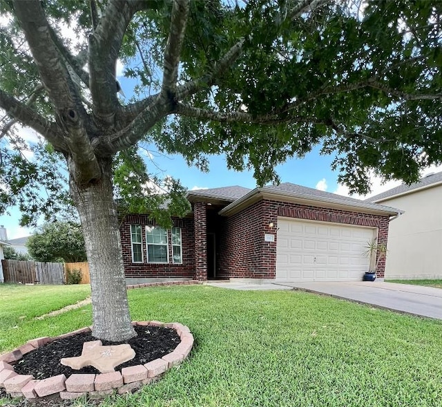 ranch-style home with driveway, fence, a garage, brick siding, and a front yard