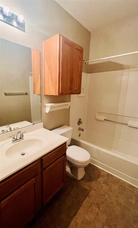 full bath featuring toilet, vanity, and shower / bathing tub combination