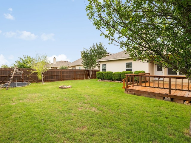 116 Brown St, Hutto, TX 78634 - view of yard featuring a deck and an outdoor fire pit