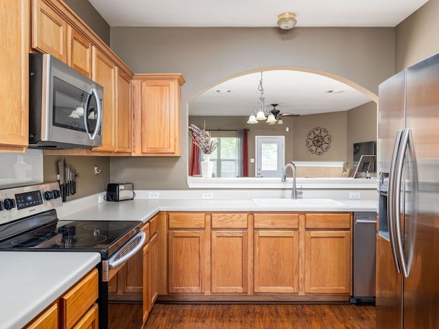 116 Brown St, Hutto, TX 78634 - kitchen with appliances with stainless steel finishes, a sink, a chandelier, and light countertops