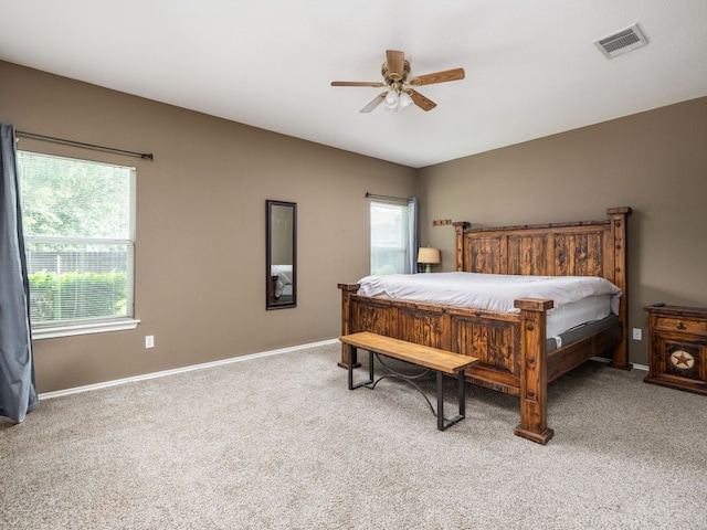 116 Brown St, Hutto, TX 78634 - bedroom featuring carpet flooring, multiple windows, baseboards, and ceiling fan
