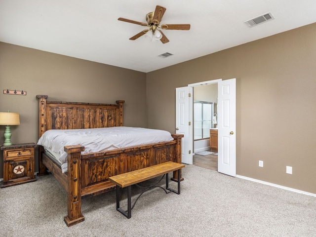 116 Brown St, Hutto, TX 78634 - bedroom with carpet flooring, baseboards, connected bathroom, and ceiling fan