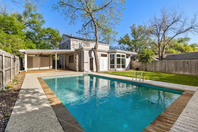 1308 N 13th St, Temple, TX 76501 - rear view of house with a fenced in pool, a fenced backyard, a patio area, a yard, and stucco siding