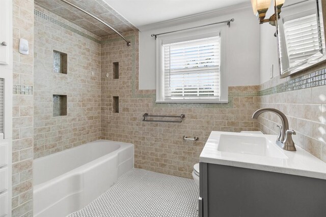 1308 N 13th St, Temple, TX 76501 - bathroom featuring washtub / shower combination, tile walls, toilet, and vanity