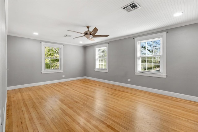 1308 N 13th St, Temple, TX 76501 - spare room featuring light wood-type flooring, visible vents, ornamental molding, and a healthy amount of sunlight