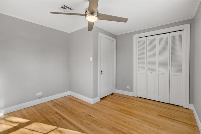 1308 N 13th St, Temple, TX 76501 - unfurnished bedroom with baseboards, crown molding, light wood-style floors, and visible vents