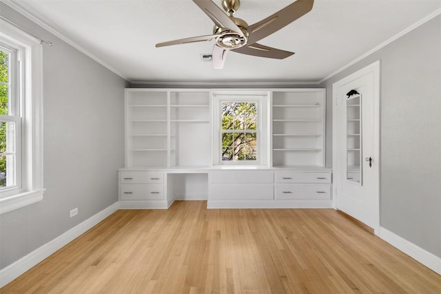 1308 N 13th St, Temple, TX 76501 - interior space with multiple windows, built in study area, and crown molding