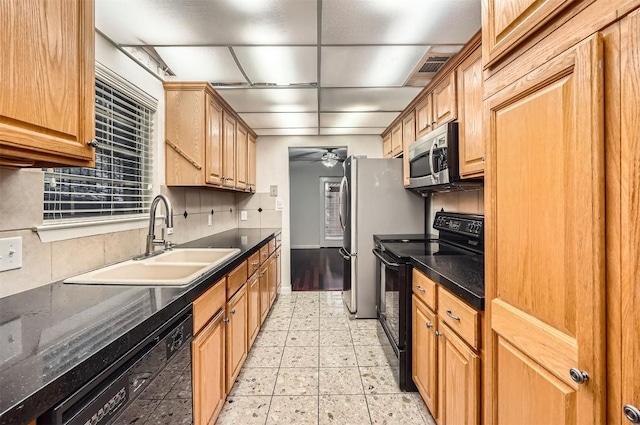 6609 Valleyside Rd, Austin, TX 78731 - kitchen featuring black appliances, ceiling fan, and tasteful backsplash