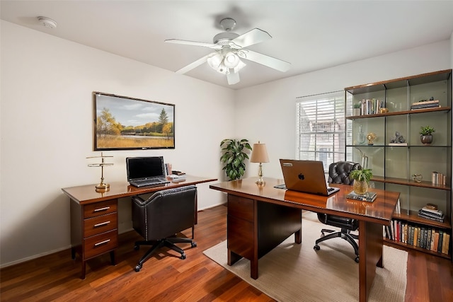 6609 Valleyside Rd, Austin, TX 78731 - home office featuring dark wood finished floors and a ceiling fan