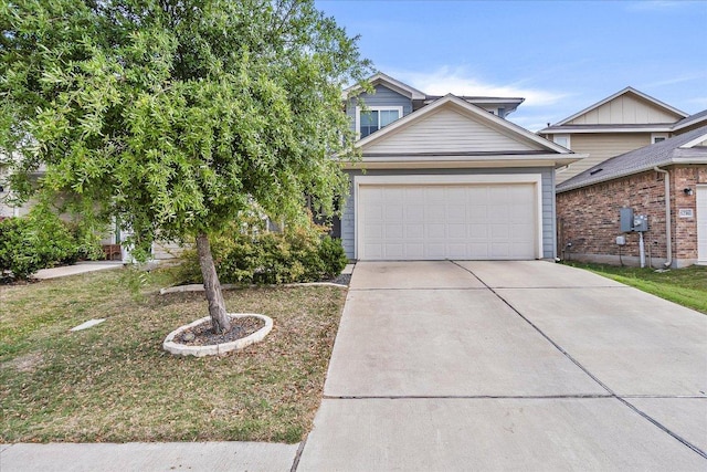 view of front of property with driveway, a front yard, and a garage