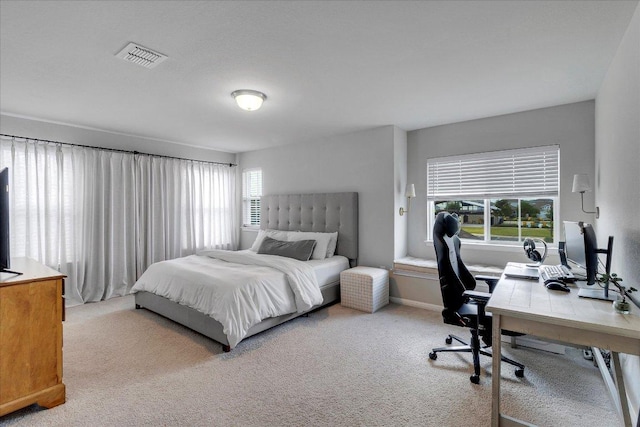 bedroom with carpet floors and visible vents