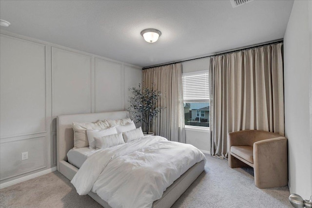 bedroom featuring light colored carpet