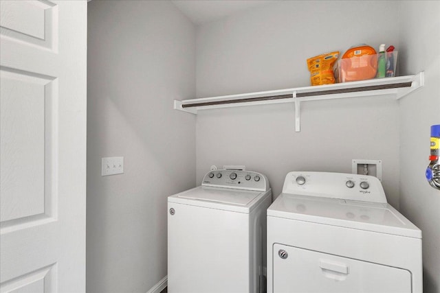 washroom with independent washer and dryer