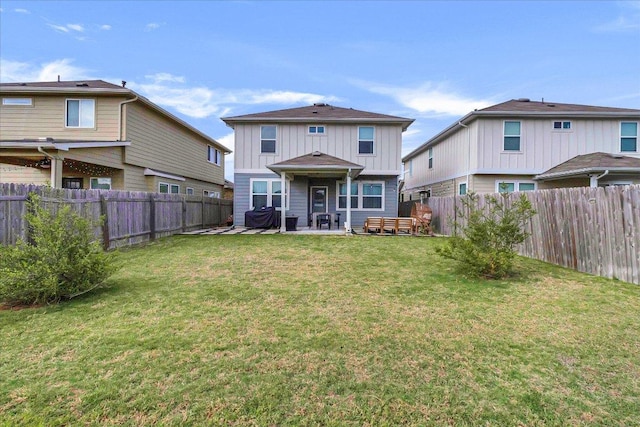 rear view of property featuring a fenced backyard, a yard, a patio, and board and batten siding