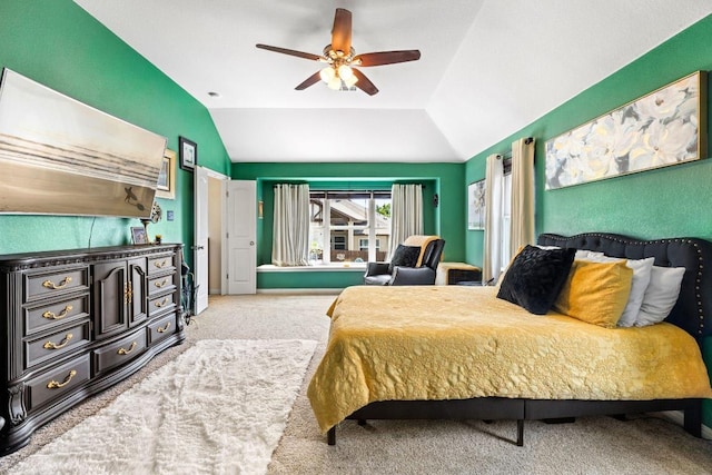 carpeted bedroom with lofted ceiling and a ceiling fan