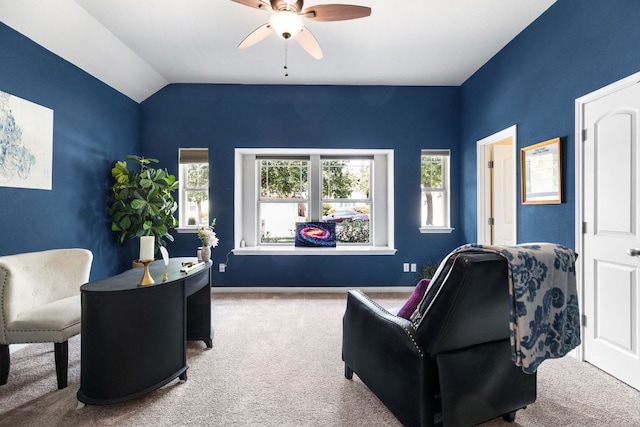 interior space featuring lofted ceiling, a ceiling fan, baseboards, and carpet floors