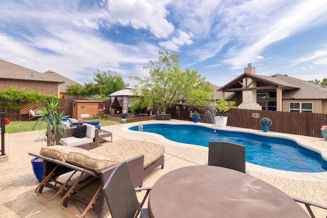 view of pool with a fenced backyard, a gazebo, a patio, and a fenced in pool
