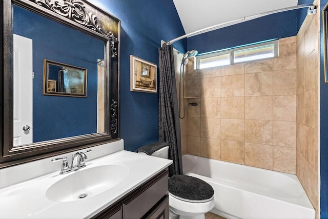 bathroom with shower / tub combo with curtain, vanity, and toilet
