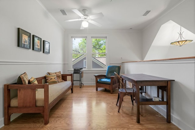 4103 Ave F, Austin, TX 78751 - sitting room featuring ornamental molding, light wood-style flooring, a ceiling fan, and baseboards