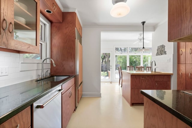 4103 Ave F, Austin, TX 78751 - kitchen featuring dishwasher, a sink, brown cabinets, crown molding, and tasteful backsplash
