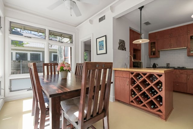 4103 Ave F, Austin, TX 78751 - dining room with crown molding and a ceiling fan