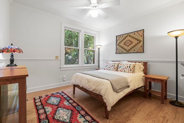 4103 Ave F, Austin, TX 78751 - bedroom with ornamental molding, wood finished floors, baseboards, and ceiling fan