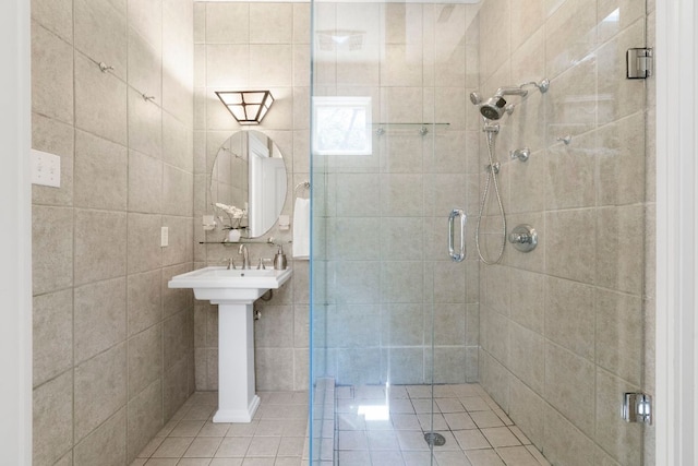 4103 Ave F, Austin, TX 78751 - bathroom with a stall shower, tile patterned flooring, and tile walls