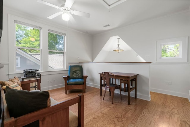 4103 Ave F, Austin, TX 78751 - sitting room with ceiling fan, wood finished floors, ornamental molding, baseboards, and attic access