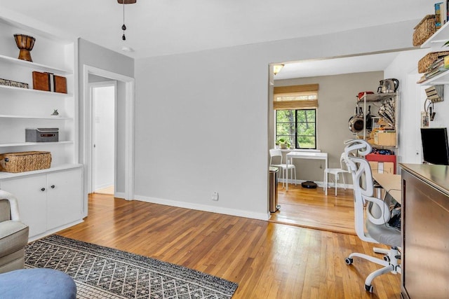 office featuring baseboards and light wood-style floors