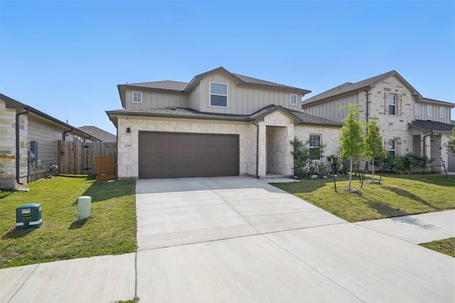 10310 Mager Ln, Hutto, TX 78634 - view of front of house with driveway, stone siding, a garage, and board and batten siding