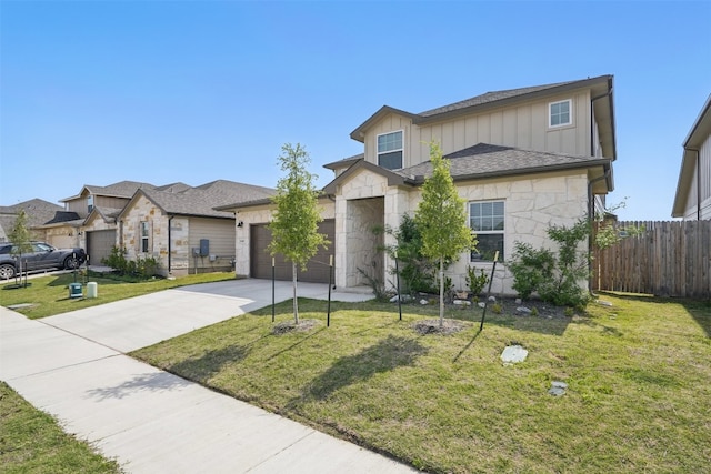 10310 Mager Ln, Hutto, TX 78634 - view of front of property featuring stone siding, board and batten siding, concrete driveway, and an attached garage