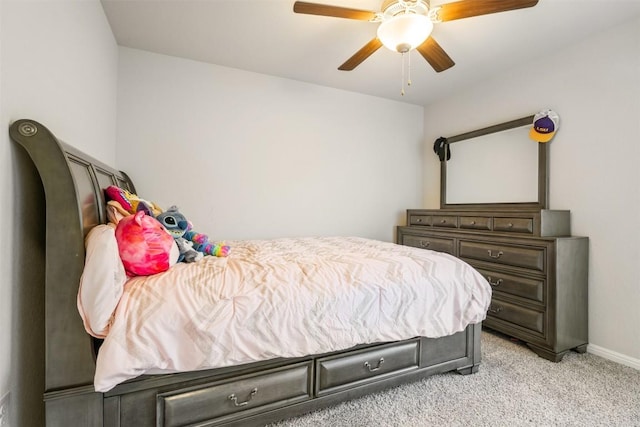 10310 Mager Ln, Hutto, TX 78634 - bedroom with light colored carpet, baseboards, and ceiling fan