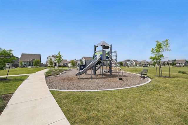 10310 Mager Ln, Hutto, TX 78634 - communal playground featuring a residential view and a yard