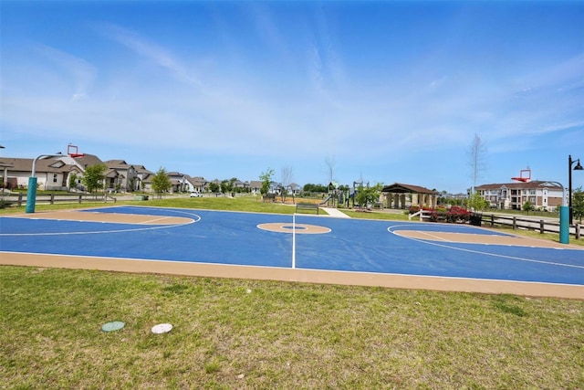 10310 Mager Ln, Hutto, TX 78634 - view of basketball court featuring community basketball court and a lawn