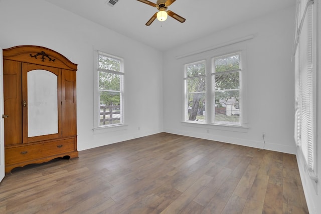 401 Shaw St, Taylor, TX 76574 - foyer with a ceiling fan, wood finished floors, and baseboards