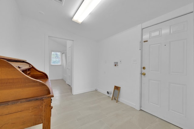 washroom with baseboards, visible vents, hookup for a washing machine, and laundry area