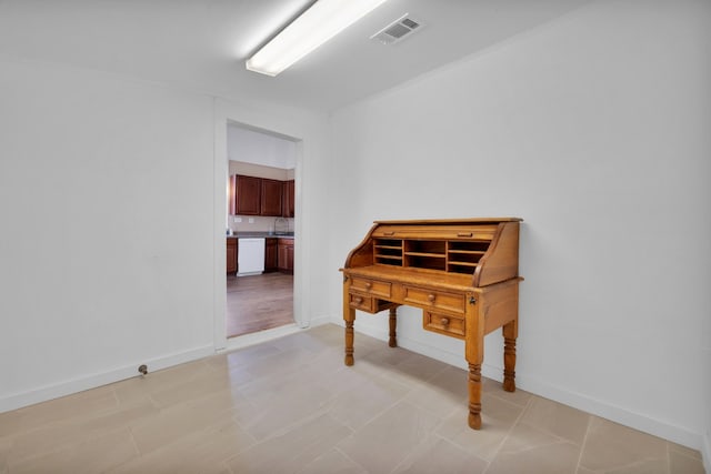 interior space featuring baseboards and visible vents