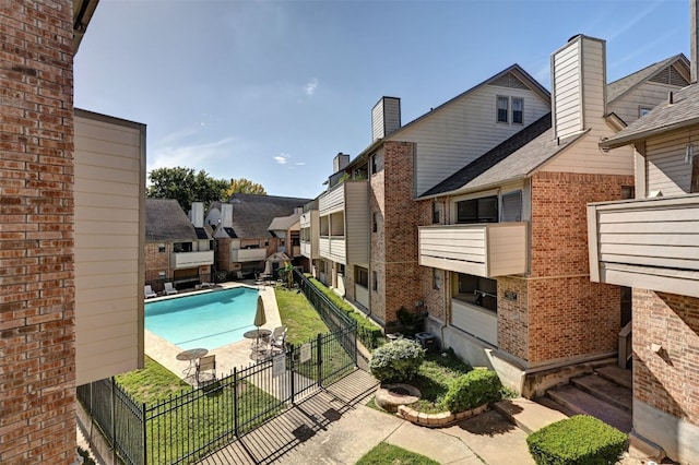 2500 Burleson Rd Unit 311, Austin, TX 78741 - community pool featuring a fenced backyard and a residential view