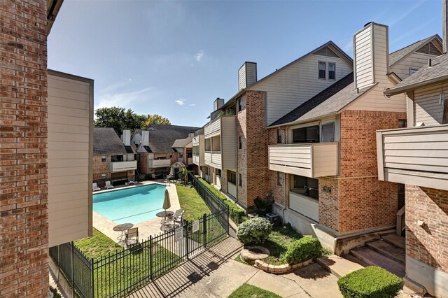 2500 Burleson Rd Unit 311, Austin, TX 78741 - community pool featuring a fenced backyard and a residential view