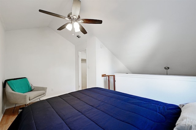 2500 Burleson Rd Unit 311, Austin, TX 78741 - bedroom with vaulted ceiling, wood finished floors, and ceiling fan