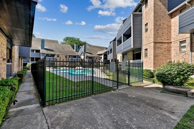 2500 Burleson Rd Unit 311, Austin, TX 78741 - view of home's community with a residential view and a pool